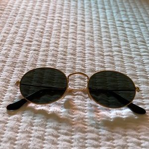 Ray-Ban oval sunglasses. Gold with black lenses.